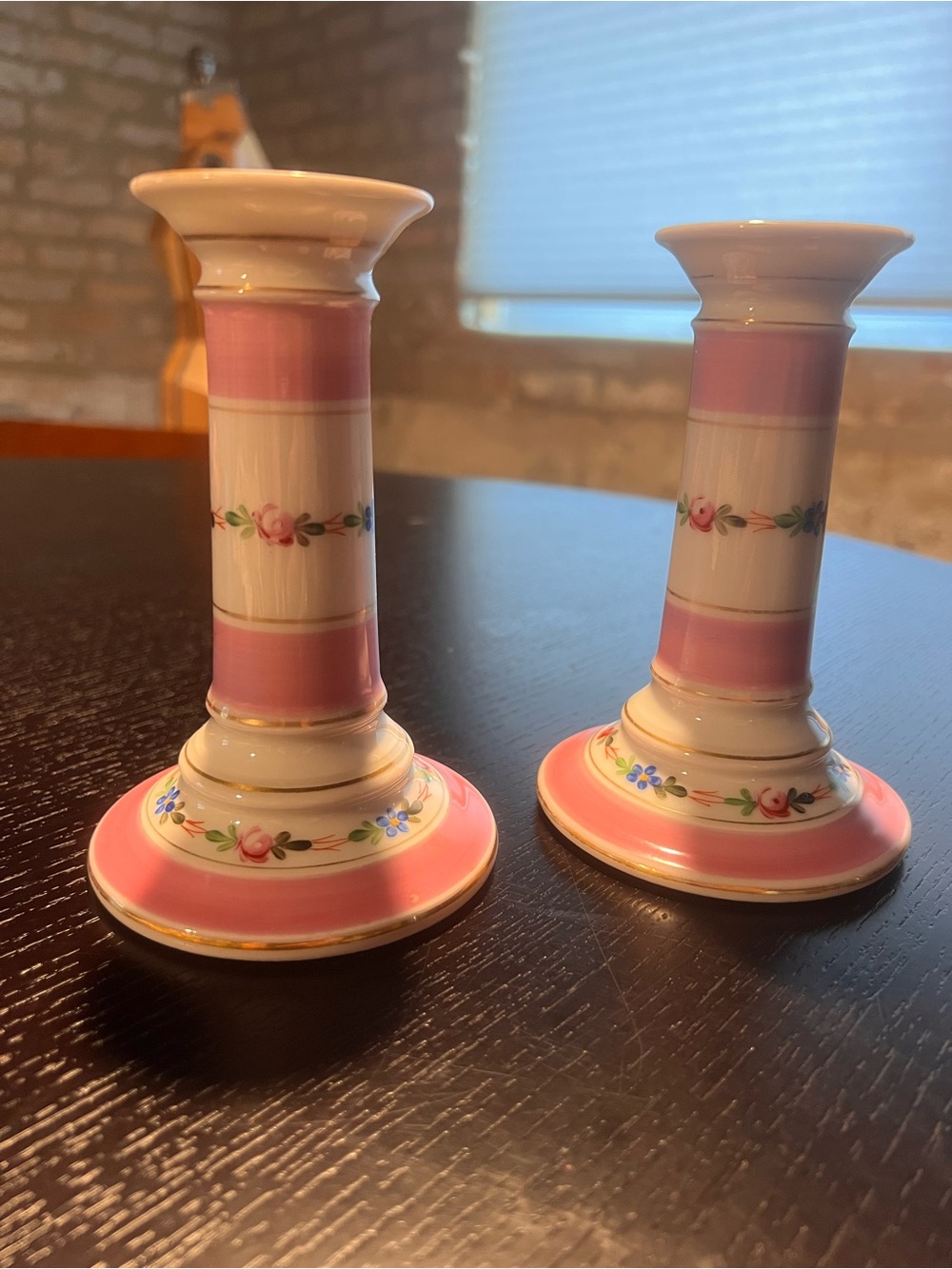 Pink and white floral motif candle stick holders.